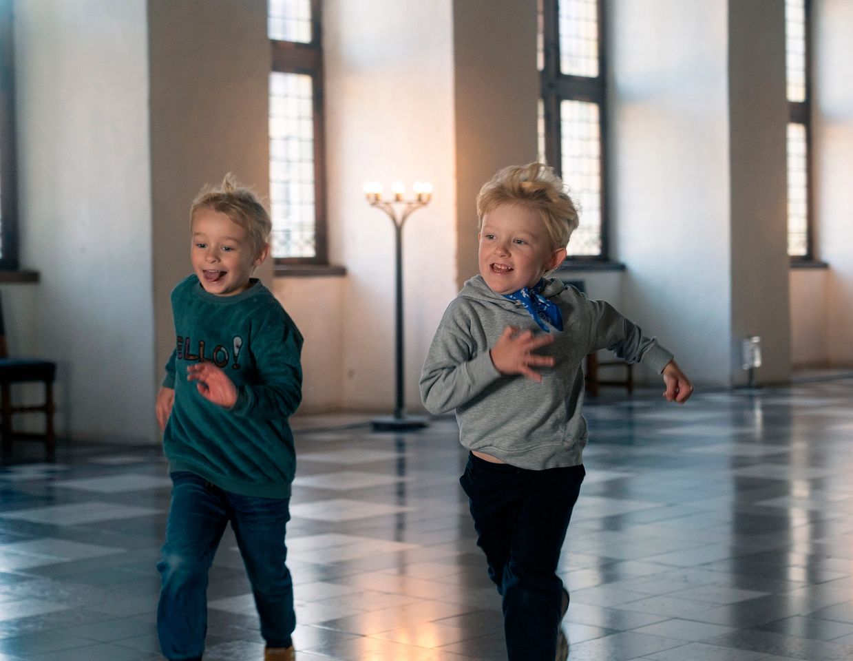 Two boys running in the dance hall