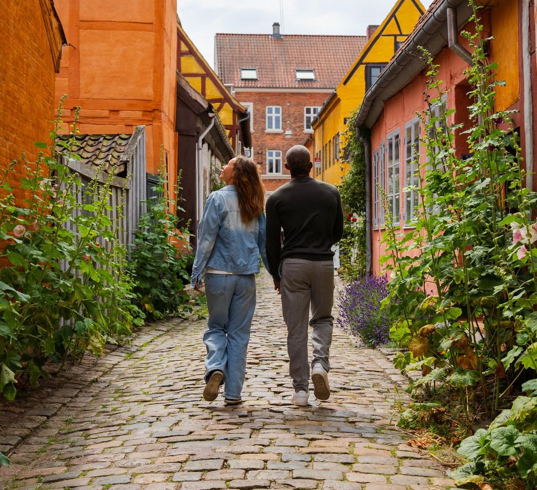 Couple walking through cozy street